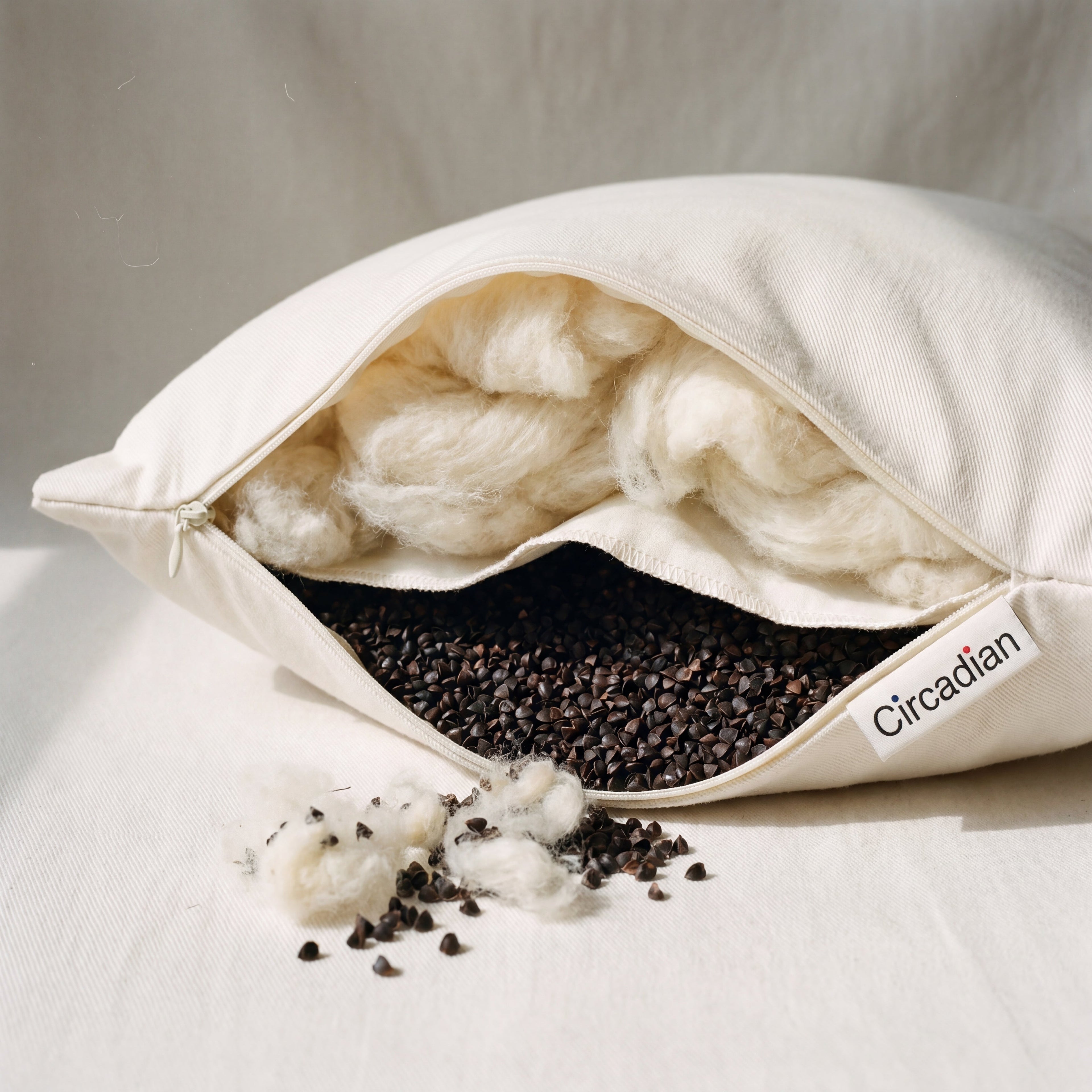 Circadian Buckwool Hybrid Pillow with dual-chamber design, wool fill and buckwheat hulls separated by an internal cotton divider