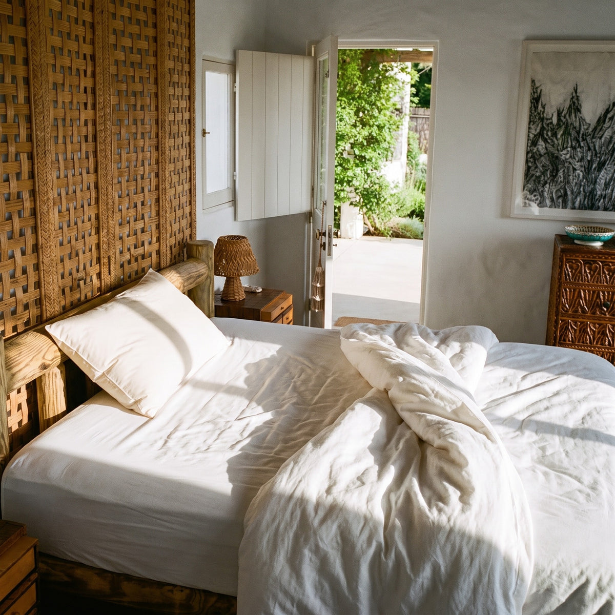 The Buckwool Hybrid Pillow at the head of a double bed, showing its standard size against the mattress.
