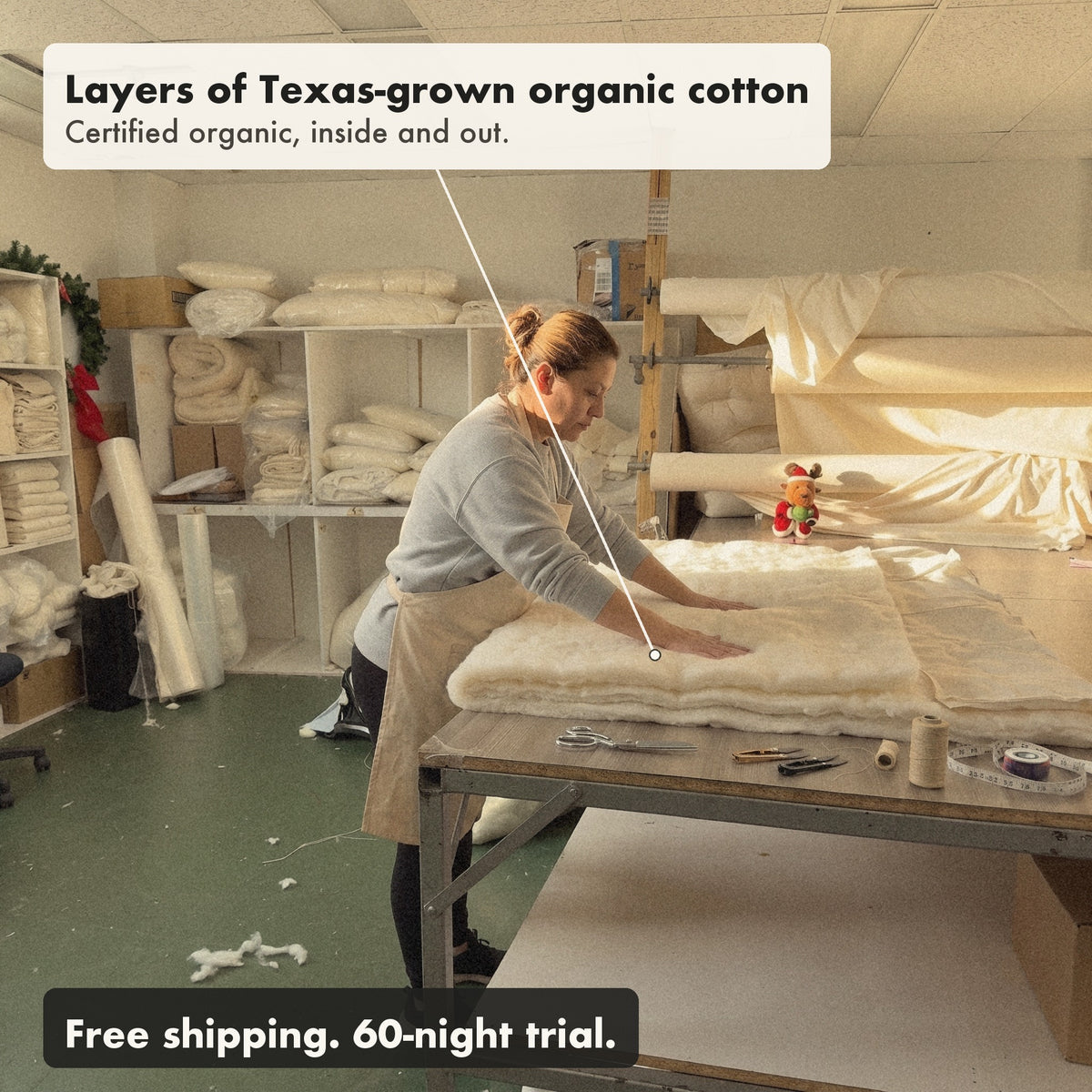 Before it is closed and tufted by hand, a worker in the New Jersey workshop smooths layers of Texas-grown organic cotton into an open Organic Cotton Comforter.