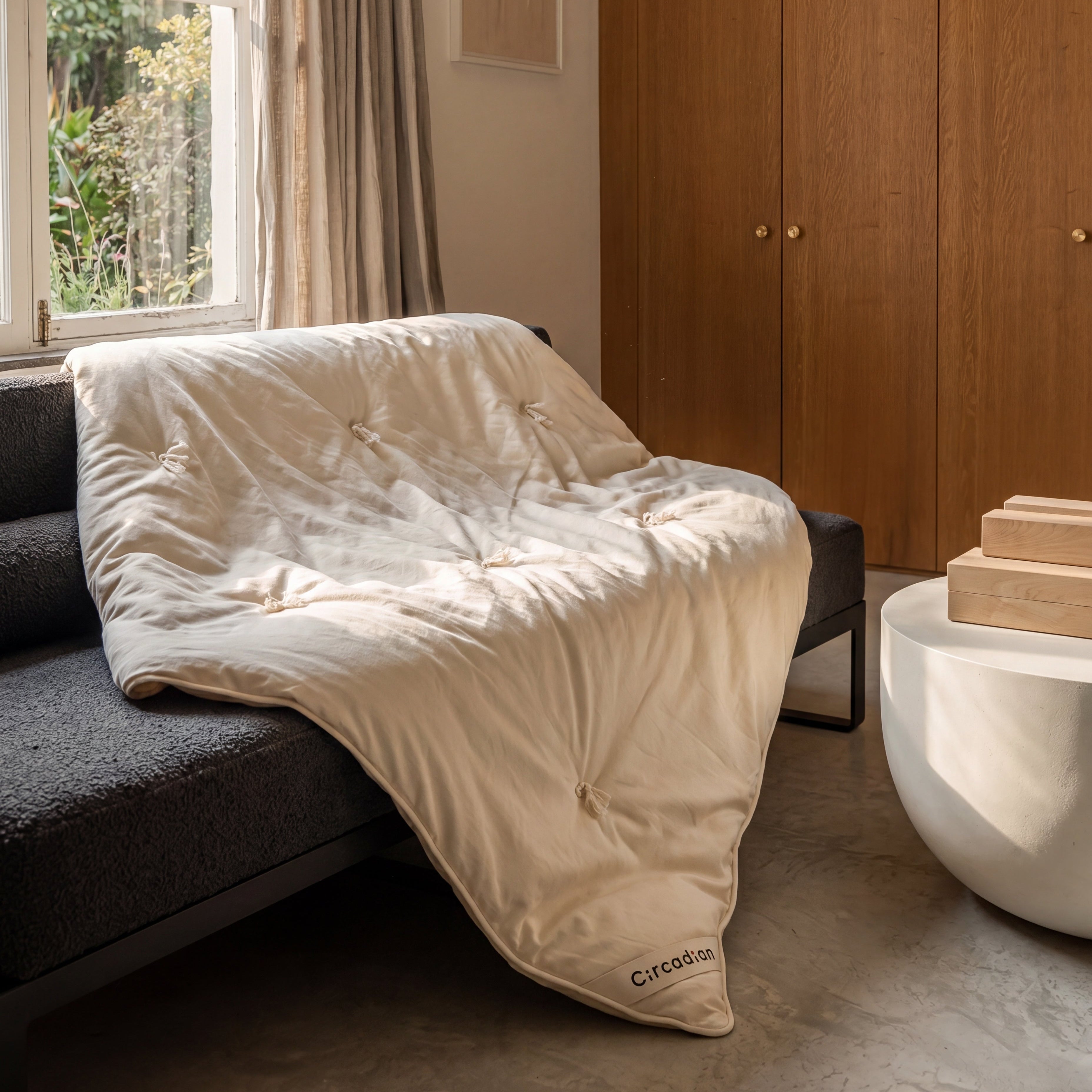 Organic cotton duvet draped across a bed showing the weight and fall of the fabric
