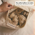 A hand opens the pillow. This is the softest pillow we make.