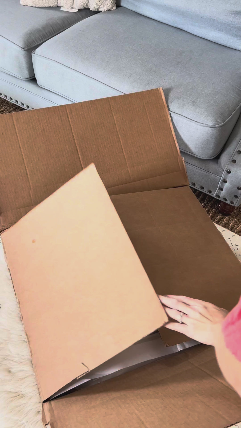 Opening a Circadian box, lifting out the Organic Cotton Pillow and unzipping it to show the organic cotton inside, then the pillow on a made bed