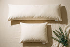 Overhead flatlay of the Circadian Body Pillow next to a standard Circadian pillow for size comparison.
