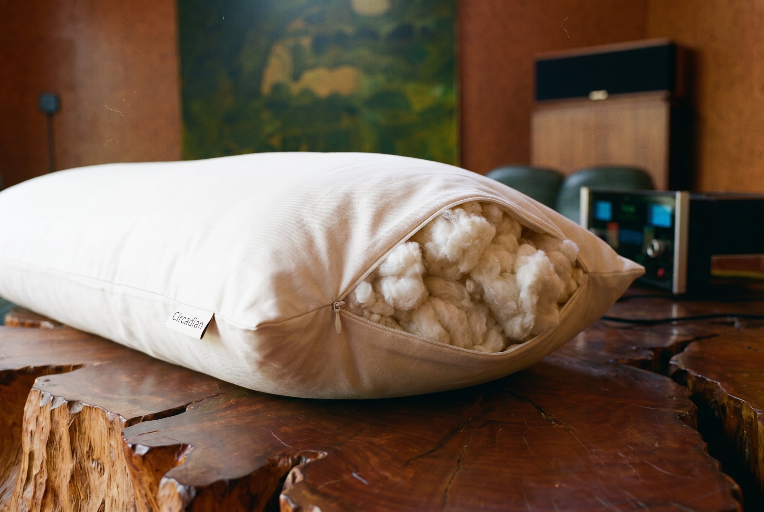Close-up of the Circadian Body Pillow side zipper open with organic cotton fill inside, showing the adjustable fill.