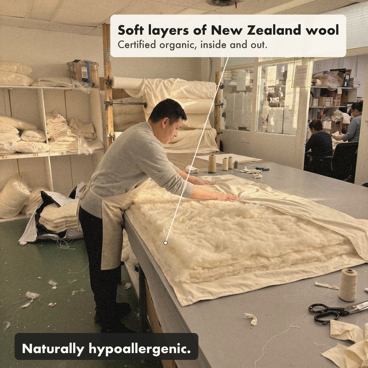 Before it is closed and tufted by hand, a worker in the New Jersey workshop smooths soft layers of carded New Zealand wool into an open Organic Wool Comforter.